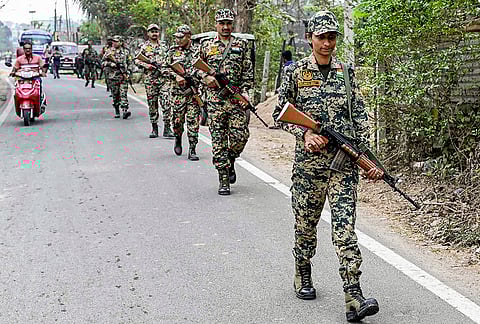 Security personnel patrol ahead of the announcement of dates for the 2026 West Bengal Assembly elections, in Nadia district, West Bengal.