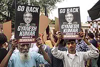 | Photo: PTI/Swapan Mahapatra : People show placards with "go back" at a demonstration during the visit of Chief Election Commissioner Gyanesh Kumar to Kalighat Kali Temple, in Kolkata.