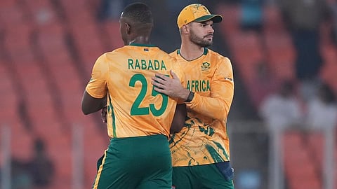 South Africa's captain Aiden Markram, right, and South Africa's Kagiso Rabada after wining against Canada during the T20 World Cup cricket match in Ahmedabad.