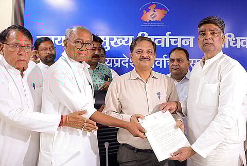 Congress leader and Rajya Sabha MP Digvijaya Singh meets Madhya Pradesh Chief Electoral Officer Sanjeev Kumar Jha and submits a memorandum over alleged discrepancies in the voter list, in Bhopal.