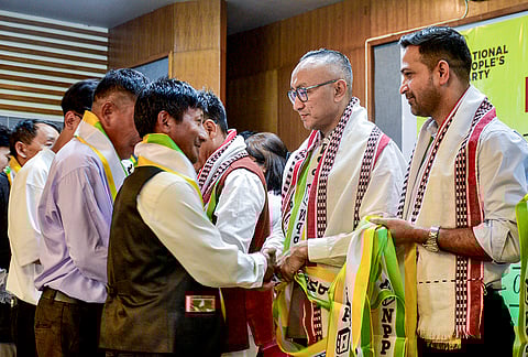 National People's Party (NPP) leaders felicitate people newly joining the party during a welcome ceremony, in Imphal.
