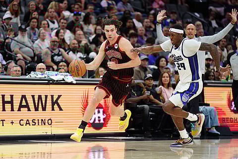 Chicago Bulls guard Josh Giddey (3) handles the ball against Sacramento Kings guard Daeqwon Plowden (29) during the second half of an NBA basketball game  in Sacramento, Calif.