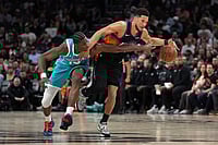 Phoenix Suns Vs Charlotte Hornets, NBA 2026: Green, Booker And Gillespie Lead Suns To One-Sided Victory – In Pics | Photo: AP/Rick Scuteri : Charlotte Hornets forward Moussa Diabate (14) pressures Phoenix Suns guard Devin Booker during the second half of an NBA basketball game in Phoenix.