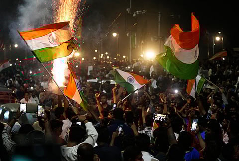 Cricket fans celebrate after India won the T20 World Cup final match against New Zealand, in Hyderabad.