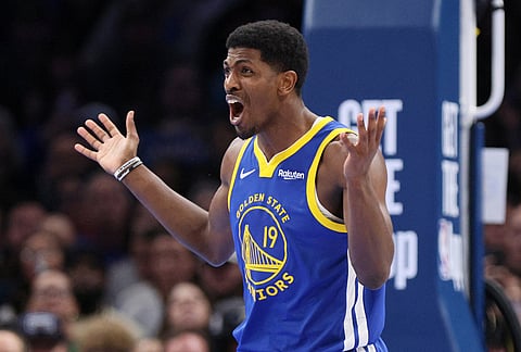 Golden State Warriors guard Nate Williams reacts after being called for a foul during the second half of an NBA basketball game, against the Oklahoma City Thunder, in Oklahoma City.