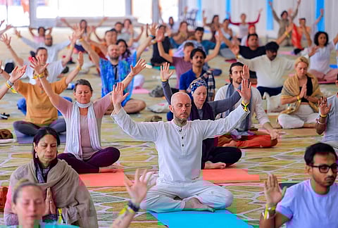 Foreign yoga practitioners take part in a session during the International Yoga Festival at Parmarth Niketan Ashram, in Rishikesh. The week-long festival from March 9 to 15 features yoga sessions, meditation workshops, spiritual discourses and cultural programmes. 