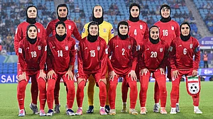 | Photo: AP/DAVE HUNT : Iran players pose for a team photo ahead of the Women's Asian Cup soccer match between Iran and the Philippines in Robina, Australia, Sunday, March 8, 2026.
