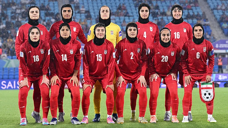 Iran players pose for a team photo ahead of the Women's Asian Cup soccer match between Iran and the Philippines in Robina, Australia, Sunday, March 8, 2026. - | Photo: AP/DAVE HUNT
