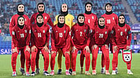 | Photo: AP/DAVE HUNT : Iran players pose for a team photo ahead of the Women's Asian Cup soccer match between Iran and the Philippines in Robina, Australia, Sunday, March 8, 2026. 