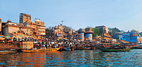 Boats line the busy ghats of Varanasi as people gather along the Ganges riverfront