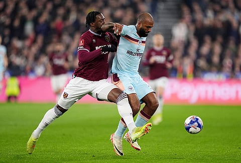 West Ham United's Axel Disasi, left, and Brentford's Igor Thiago in action during the English FA Cup fifth round soccer match between West Ham United and Brentford in London.