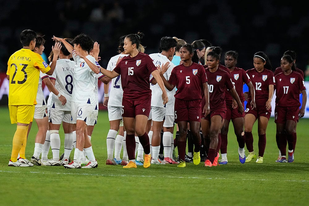 Players of the two teams greet each other at the end of the Women's Asian Cup soccer match between India and Taiwan in Sydney. - | Photo: AP/Rick Rycroft