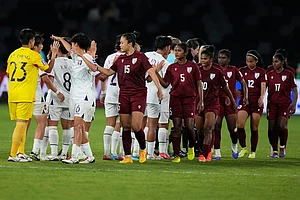 | Photo: AP/Rick Rycroft : Players of the two teams greet each other at the end of the Women's Asian Cup soccer match between India and Taiwan in Sydney.