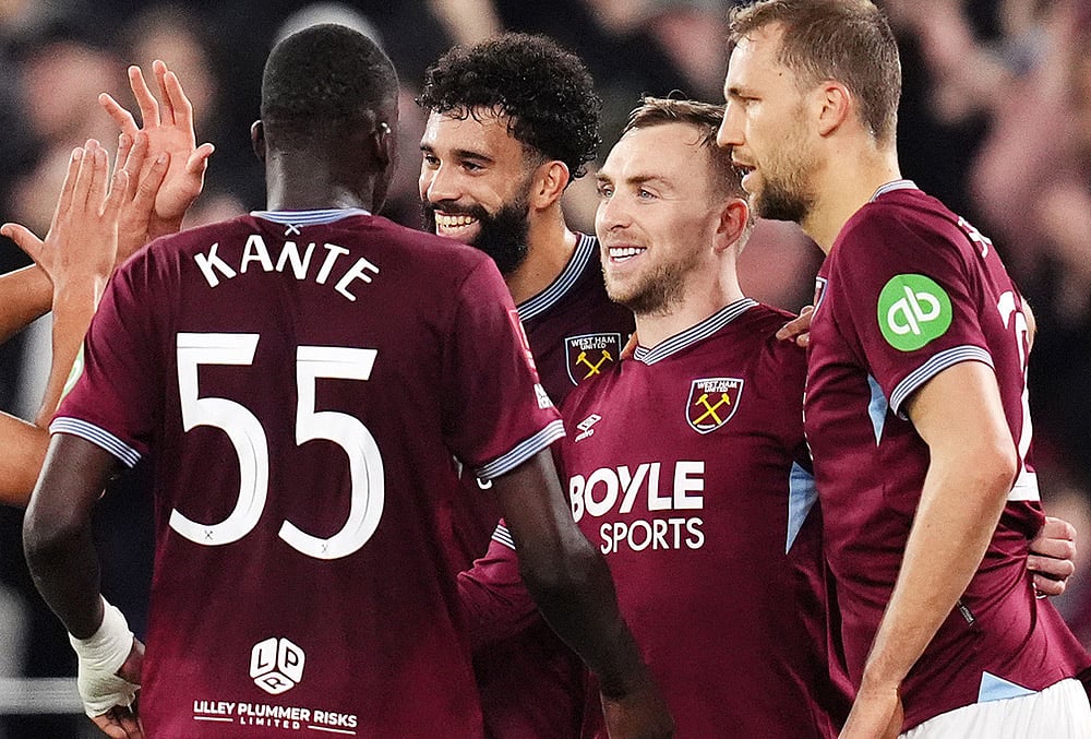 West Ham United's Jarrod Bowen, second right, celebrates scoring with teammates during the English FA Cup fifth round soccer match between West Ham United and Brentford in London. - | Photo: John Walton/PA via AP