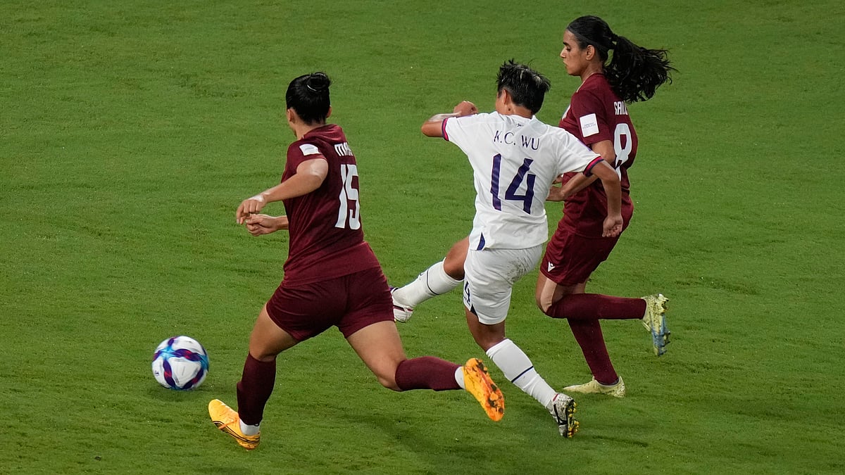 Taiwan's Wu Kai Ching, center, takes a shot between India's Martina Thokchom, left, and India's Sanju Yadav during the Women's Asian Cup soccer match between India and Taiwan in Sydney, Monday, March 10, 2026. - APRick Rycroft