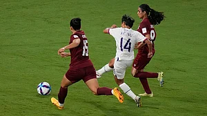 APRick Rycroft : Taiwan's Wu Kai Ching, center, takes a shot between India's Martina Thokchom, left, and India's Sanju Yadav during the Women's Asian Cup soccer match between India and Taiwan in Sydney, Monday, March 10, 2026.