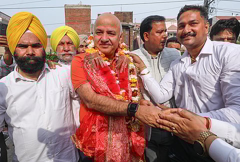 AAP leader Manish Sisodia being welcomed during a meeting with party workers, in Jammu.