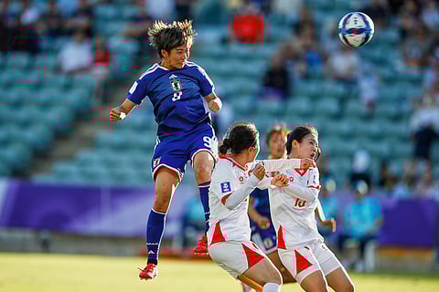 Japan's Riko Ueki heads the ball towards goal during the Women's Asian Cup soccer match between Japan and Vietnam in Perth, Australia.