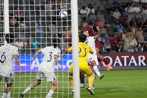 India's Pyari Xaxa, right, makes an attempt to score during the Women's Asian Cup soccer match between India and Taiwan in Sydney.