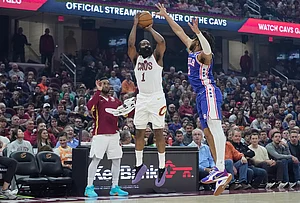 | Photo: AP/Sue Ogrocki : Cleveland Cavaliers guard James Harden (1) shoots as Philadelphia 76ers forward Trendon Watford (12) defends and teammate Donovan Mitchell, left, looks on in the first half of an NBA basketball game in Cleveland.