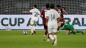 (AP Photo/Rick Rycroft) : Taiwan's Chen Yu-chin, left, scores her side's third goal during the Women's Asian Cup soccer match between India and Taiwan in Sydney, Monday, March 10, 2026