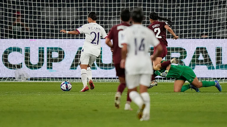 Taiwan's Chen Yu-chin, left, scores her side's third goal during the Women's Asian Cup soccer match between India and Taiwan in Sydney, Monday, March 10, 2026 - (AP Photo/Rick Rycroft)