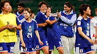 | Photo: AP/Gary Day : Japan's Hana Takahashi and Japan's Riko Ueki embrace as they leave the field following the Women's Asian Cup soccer match between Japan and Vietnam in Perth, Australia, Tuesday, March 10, 2026. (