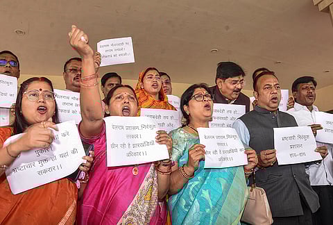BJP MLAs hold placards during a protest amid the ongoing Budget session of the Jharkhand Assembly, in Ranchi, Jharkhand.