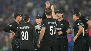 | Photo: AP/Rafiq Maqbool : New Zealand's James Neesham, center, celebrates the wicket of India's Sanju Samson with teammates during the T20 World Cup cricket final match between India and New Zealand in Ahmedabad.