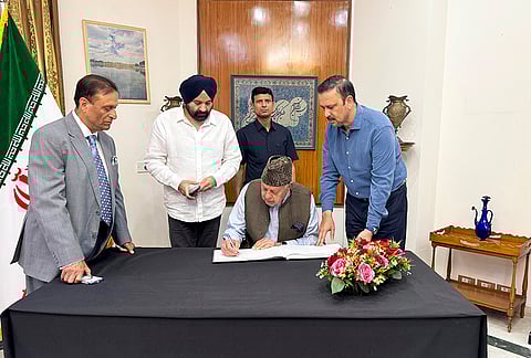 Jammu and Kashmir National Conference president Farooq Abdullah signs the condolence book at the Embassy of the Islamic Republic of Iran following the killing of Iran's Supreme Leader Ayatollah Ali Khamenei, in New Delhi. MP Chowdry Mohammad Ramzan and others are also seen. 