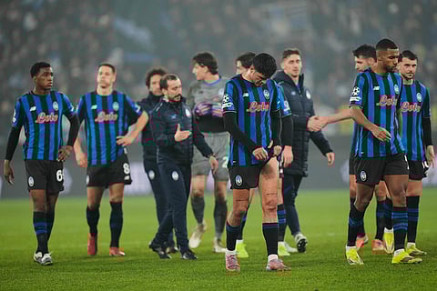 Atalanta players leave the field after the Champions League round of 16 soccer match between Atalanta and FC Bayern Munich in Bergamo, Italy.