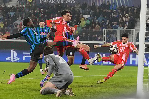 Bayern's Jamal Musiala scores his side's sixth goal during the Champions League round of 16 soccer match between Atalanta and FC Bayern Munich in Bergamo, Italy.