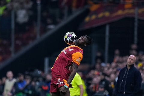Galatasaray's Wilfried Singo controls the ball with his chest during a Champions League round of 16 first leg soccer match between Galatasaray and Liverpool, in Istanbul, Turkey.