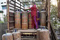 Modi To Review Meeting Ensuring Energy, Fertiliser Supply Amid West Asia Crisis | Photo: PTI : A worker arranges commercial LPG cylinders on a vehicle amid a shortage of cooking gas, in Saroli area of Surat, Gujarat, Tuesday, March 10, 2026. The shortage follows disruptions in LPG supplies linked to the ongoing West Asia conflict affecting global energy supply chains.