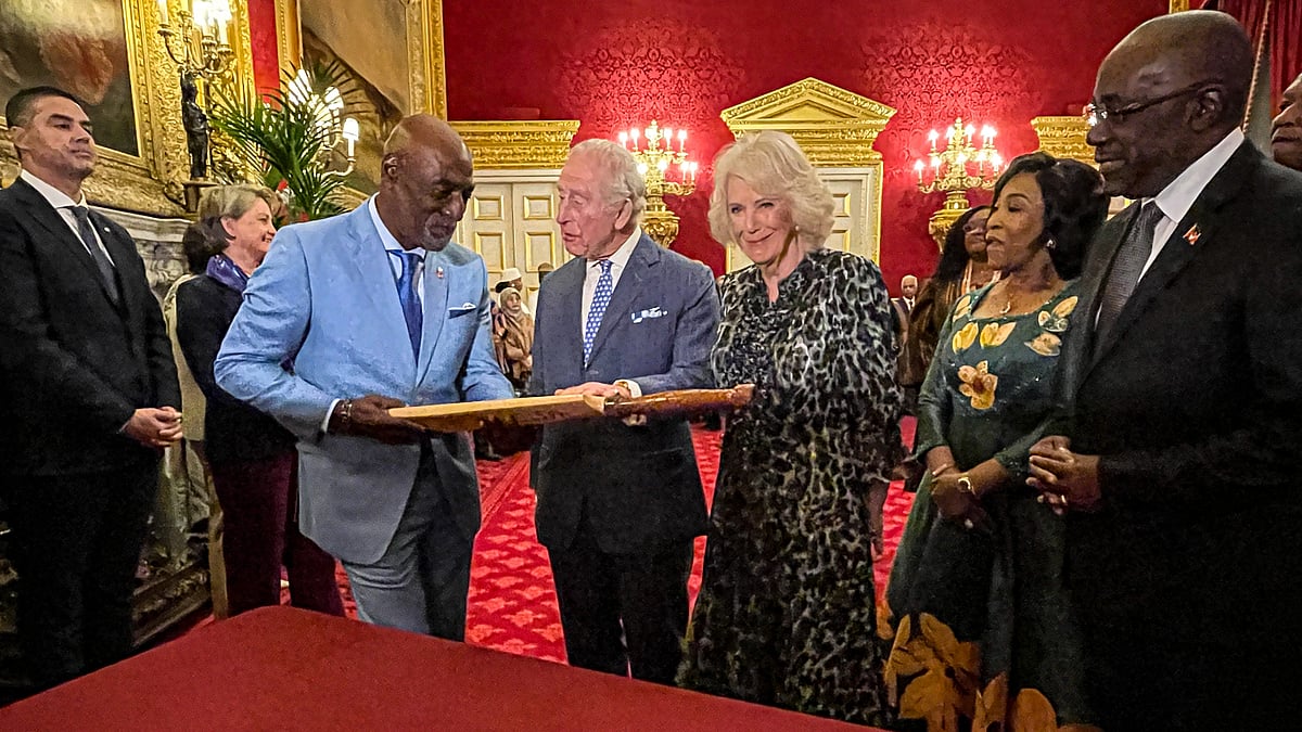 Former West Indies cricketer Sir Viv Richards presents a special cricket bat to King Charles III and Queen Camilla at St. James's Palace in London. - PTI
