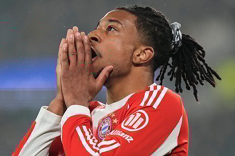 Bayern's Michael Olise reacts during the Champions League round of 16 soccer match between Atalanta and FC Bayern Munich in Bergamo, Italy.