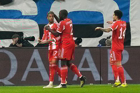 Bayern's Michael Olise (17) celebrates after scoring his side's second goal during the Champions League round of 16 soccer match between Atalanta and FC Bayern Munich in Bergamo, Italy.