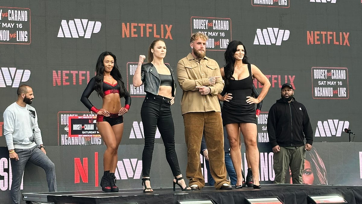 Ronda Rousey, center left, and Gina Carano, right, pose with promoter Jake Paul, center right, during a news conference in Inglewood, Calif., Tuesday, March 10, 2026.  - AP