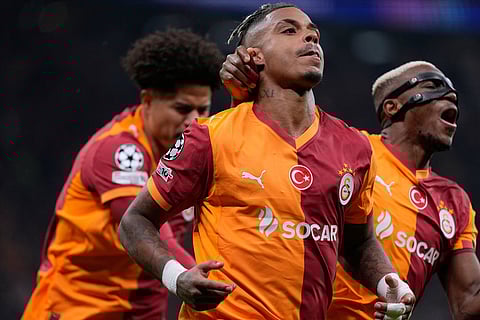 Galatasaray's Mario Lemina celebrates after scoring the opening goal during a Champions League round of 16 first leg soccer match between Galatasaray and Liverpool, in Istanbul, Turkey.