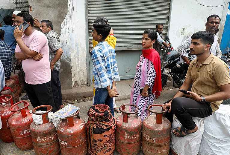 People queue up to book LPG cylinders at an Indane gas agency in Lalbagh area of Lucknow, Tuesday, March 10, 2026. Long queues were seen at several gas agencies amid an ongoing LPG supply shortage in the country. - | Photo: PTI/Nand Kumar