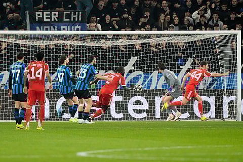 Bayern's Josip Stanisic celebrates after scoring his side's opening goal during the Champions League round of 16 soccer match between Atalanta and FC Bayern Munich in Bergamo, Italy.