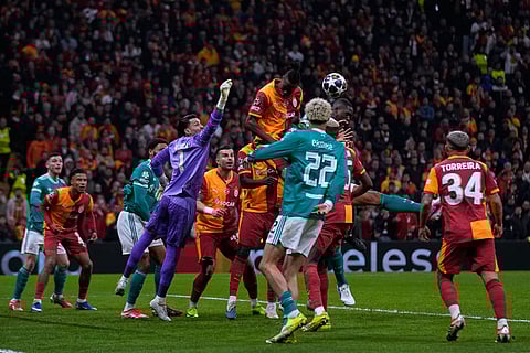 Galatasaray's Wilfried Singo, top, heads the ball during a Champions League round of 16 first leg soccer match between Galatasaray and Liverpool, in Istanbul, Turkey.