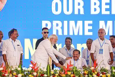 Prime Minister Narendra Modi with Akhila Kerala Dheevara Sabha president MP Varikkakseri and BJP leaders during the Golden Jubilee Sammelan, in Kochi. 
