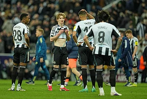| Photo: AP/Jon Super : Newcastle's Anthony Gordon, center, reacts after the Champions League round of 16 first leg soccer match between Newcastle United and Barcelona in Newcastle , England.