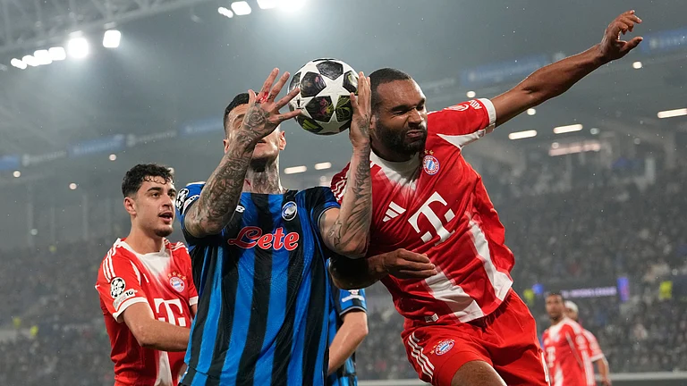 Atalanta's Gianluca Scamacca, left, and Bayern's Jonathan Tah challenge for the ball during the Champions League round of 16 soccer match between Atalanta and FC Bayern Munich in Bergamo, Italy. - AP/Luca Bruno