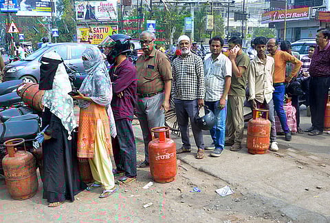 People queue up to book LPG cylinders at an Indane gas agency, in Ranchi, Jharkhand, Wednesday, March 11, 2026.