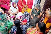 Bulldozers And Barricades Descend On Uttam Nagar After Holi Clash | Photo: Suresh K Pandey/Outlook : Tarun Kumar’s mother, Sunita, sitting outside her home in Uttam Nagar, Delhi, surrounded by women who had come to comfort her after her son’s alleged killing.