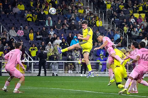 Nashville SC midfielder Reed Baker-Whiting, center, takes a shot against Inter Miami in the second half of a CONCACAF Champions Cup Round of 16 soccer match  in Nashville, Tenn.