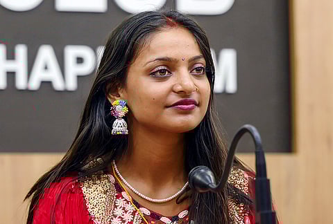 Monalisa from Indore, who went viral on social media at the Kumbh Mela, during a press conference, in Thiruvananthapuram, Thursday, March 12, 2026. The couple got married at a temple in Thiruvananthapuram .