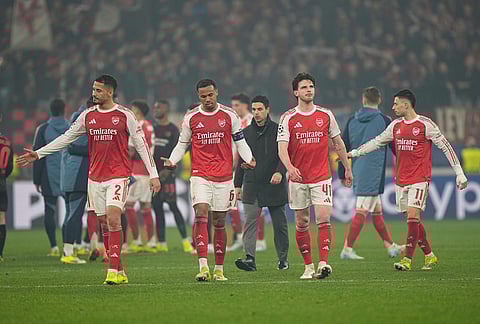Arsenal players go to their team's fans after the Champions League round of 16 first leg soccer match between Bayer Leverkusen and Arsenal FC in Leverkusen, Germany.